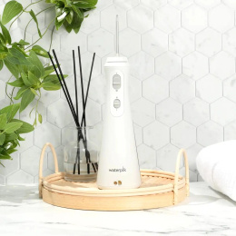 Ирригатор Waterpik WP-490 EU портатив. импульсн. 4насад. белый